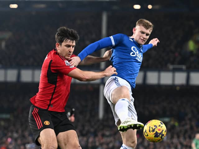 Harry Maguire battles Jarrad Branthwaite for the ball