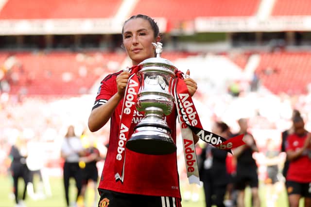 Katie Zelem holds the FA Cup trophy