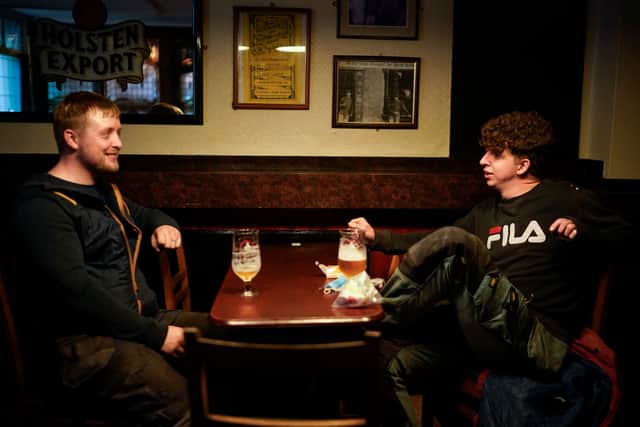 Two men enjoy a drink at a pub in Manchester in October 2020   Credit: Christopher Furlong/Getty Images