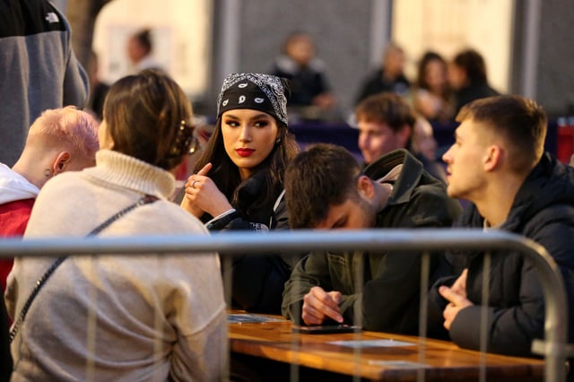 <p>A group of friends outside a pub in Manchester after Covid restrictions were lifted in April Credit: Charlotte Tattersall/Getty Images</p>