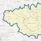 A map of the GM Clean Air Zone, showing the boundary in blue and excluded roads in purple