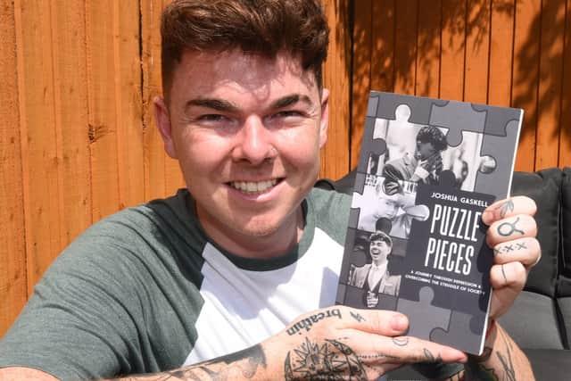 Josh Gaskell with his book Puzzle Pieces. Photo: Michelle Adamson/JPIMedia