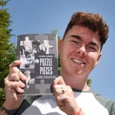 Josh Gaskell with his book. Photo: Michelle Adamson/JPIMedia