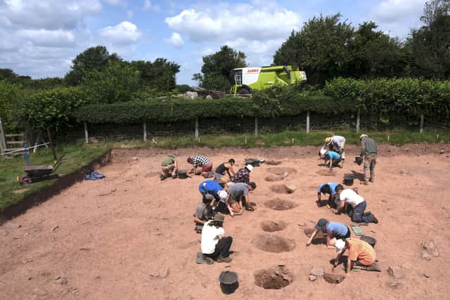 Students excavating the avenue of postholes leading toward the mound of Arthur’s Stone. Photo: Adam Stanford