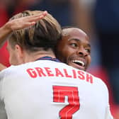 Jack Grealish and Raheem Sterling celebrate a goal for England. Credit: Getty.
