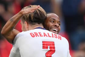 Jack Grealish and Raheem Sterling celebrate a goal for England. Credit: Getty.