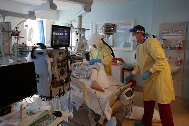 Staff at work on a Covid ICU ward in March Credit: Getty Images