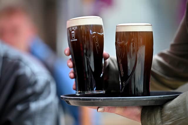 Pints of Guinness being served. Photo by Jeff J Mitchell/Getty Images
