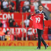 New signing, Raphael Varane of Manchester United is introduced to fans on the pitch prior to the Premier League match between Manchester United  and  Leeds United at Old Trafford on August 14, 2021  (Photo by Catherine Ivill/Getty Images,)