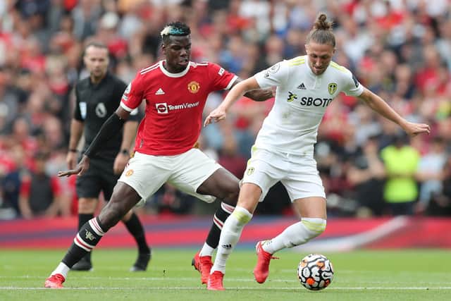 Luke Ayling is challenged by Paul Pogba Credit: Getty