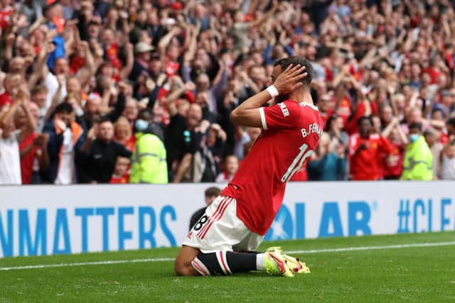 Bruno Fernandes of Manchester United celebrates  his hat-trick in front of the fans Credit: Getty