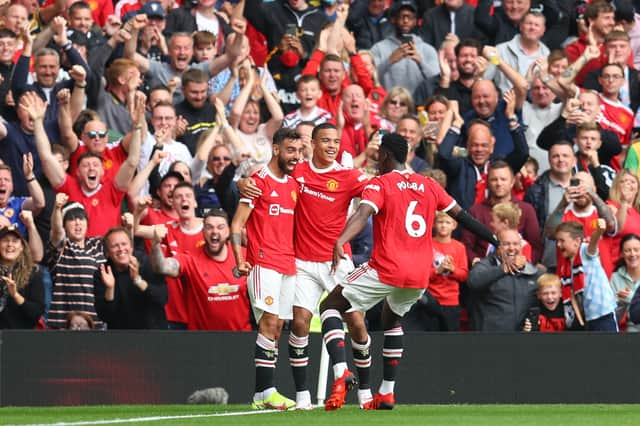 Mason Greenwood celebrates with Bruno Fernandes and Paul Pogba. Credit: Getty.