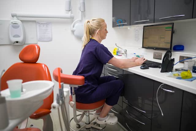Dentist Joanna Selby carrying out a phone appointment. Photo: Leon Neal/Getty Images