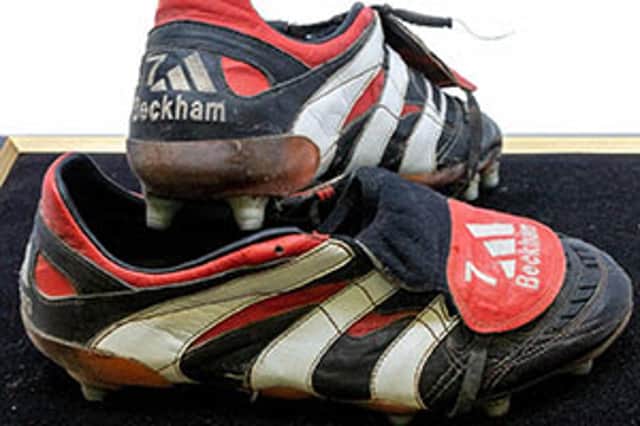 <p>David Beckham’s treble winning boots Credit: SWNS</p>