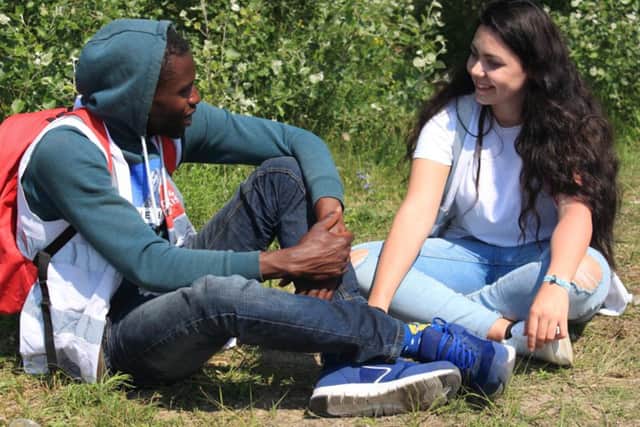 Care4Calais is encouraging volunteers to sign up to talk to asylum seekers and refugees