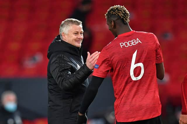 Ole Gunnar Solskjaer and Paul Pogba. Credit: Getty.