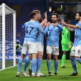Manchester City players celebrate scoring a goal. Credit: Getty.