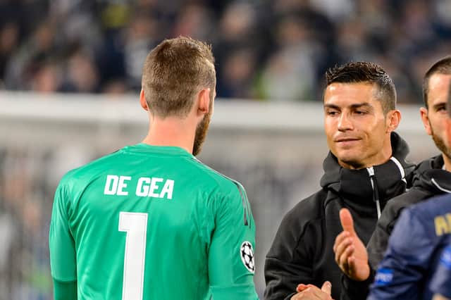 <p>Ronaldo shakes hands with de Gea  Credit: Shutterstock</p>