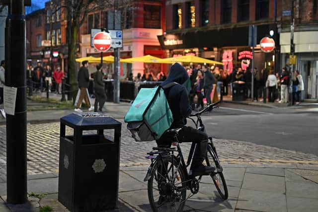 A Deliveroo cyclist in the Northern Quarter in Manchester. Photo: Oli Scarff/AFP via Getty Images