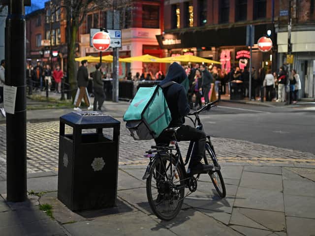 A Deliveroo cyclist in the Northern Quarter in Manchester. Photo: Oli Scarff/AFP via Getty Images