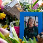 A picture of Sarah Everard sits amongst flowers left at the bandstand on Clapham Common.  Photo by Ming Yeung/Getty Images