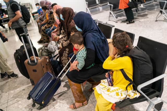 Afghan refugees waiting to be processed after arriving in the UK. Photo: Getty Images 