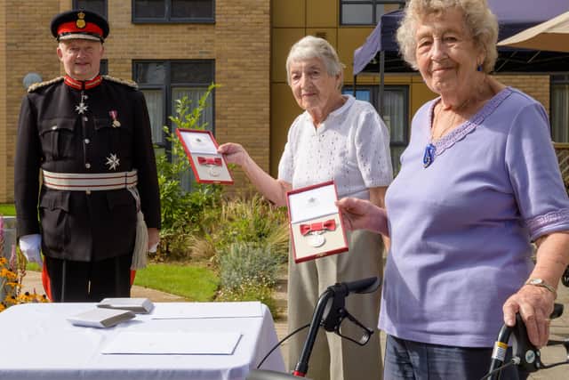 Sonja Sternberg (L) and Gisela Feldman (R) with the Lord Lieutenant of Greater Manchester