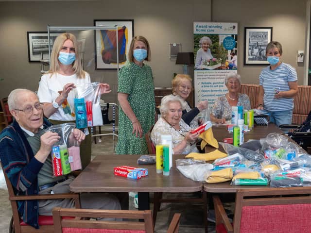 Residents at Belong Morris Feinmann helping Afghan refugees