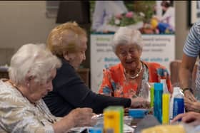 Residents at Belong Morris Feinmann helping refugees from Afghanistan