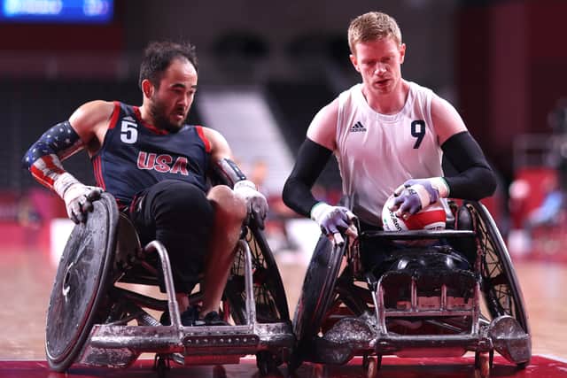 Chuck Aoki of the USA and Jim Roberts of Great Britain battling in the wheelchair rugby final at the Paralympic Games.  Photo by Alex Pantling/Getty Images