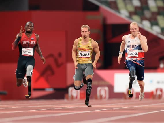 Jonnie Peacock (right) in action in the 100m men’s T64 final at the Paralympic Games. Photo by Carmen Mandato/Getty Images