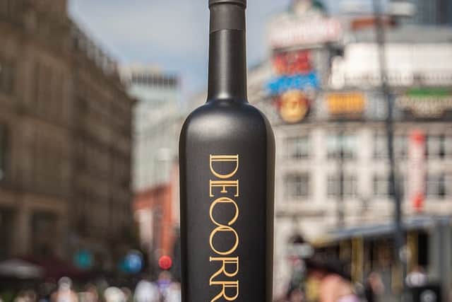A Decorrum bottle in front of the Printworks in Manchester