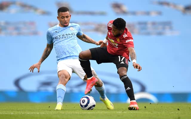 <p>Gabriel Jesus and Fred challenge for the ball. Credit: Getty.</p>