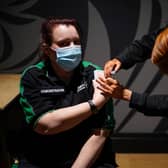 Volunteers were trained by St John Ambulance instructors to administer Covid-19 vaccines at Old Trafford earlier this year  Credit: Getty Images