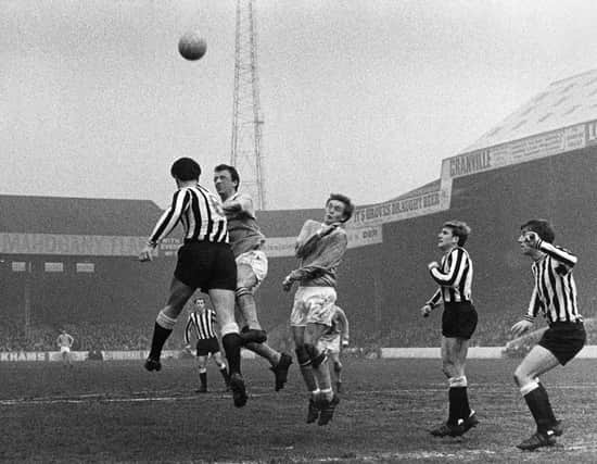 Manchester City’s Mike Summerbee challenges for the ball (second left) v Newcastle 1969 by Sefton Samuels