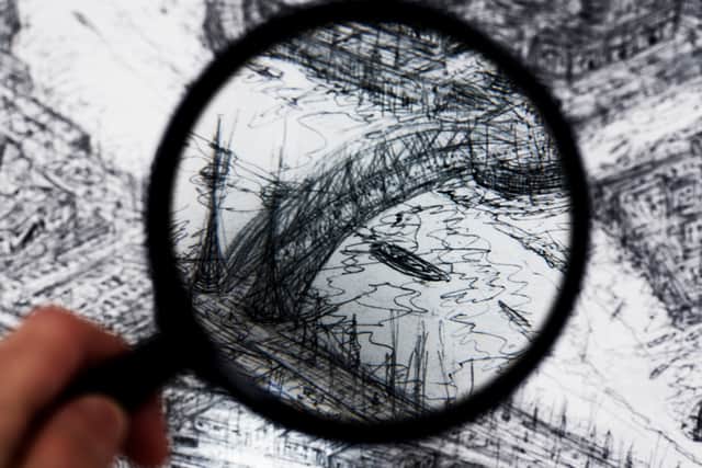A magnifying glass reveals close-up details in the drawing’s depiction of the MediaCity area