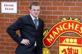 Wayne Rooney poses after signing for Manchester United from Everton in 2004. Picture: AUL BARKER/AFP via Getty Images