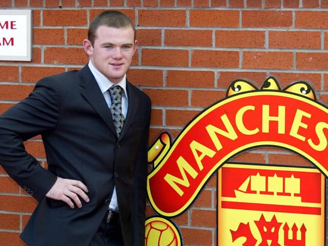 Wayne Rooney poses after signing for Manchester United from Everton in 2004. Picture: AUL BARKER/AFP via Getty Images