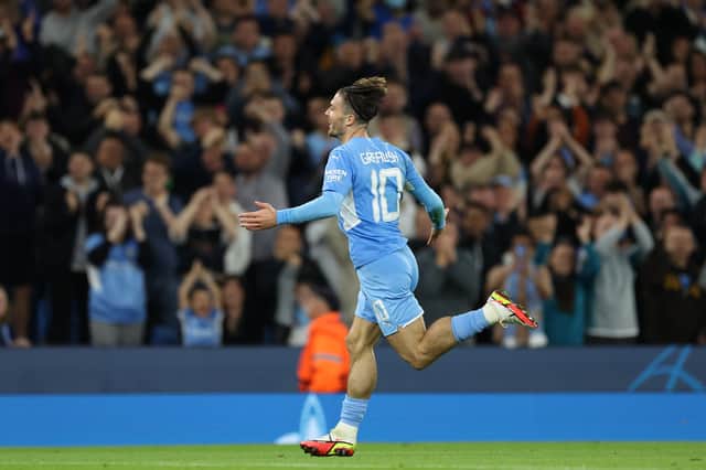 MANCHESTER, ENGLAND - SEPTEMBER 15: Jack Grealish of Manchester City celebrates after scoring their side’s fourth goal during the UEFA Champions League group A match between Manchester City and RB Leipzig at Etihad Stadium on September 15, 2021 in Manchester, England. (Photo by Richard Heathcote/Getty Images)