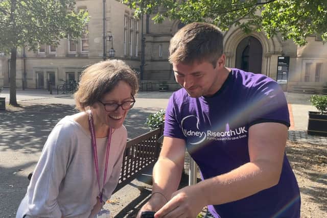Tom Goodwin talking to Professor Rachel Lennon in Manchester during his charity trek