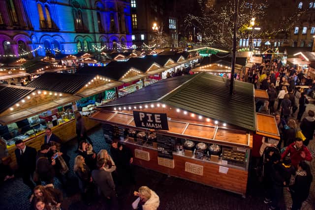 hoppers enjoy Manchester’s Christmas Market with food stalls, bars, Christmas decorations and various gift stalls outside Manchester Town Hall.  Photo: Richard Stonehouse/Getty Images