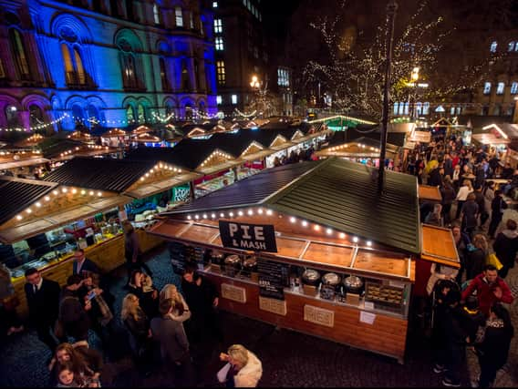 Shoppers enjoy Manchester’s Christmas Market with food stalls, bars, Christmas decorations and various gift stalls outside Manchester Town Hall.  Photo: Richard Stonehouse/Getty Images