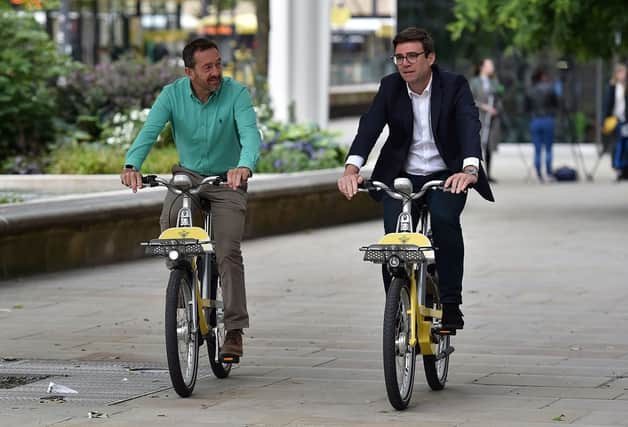 Chris Boardman with Andy Burnham Credit: TFGM