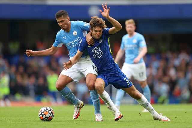Marcos Alonso of Chelsea   battles for possession with Rodrigo of Manchester City  Credit: Getty Images