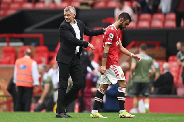 <p>Ole Gunnar Solskjaer with Bruno Fernandes Credit: Getty Images</p>