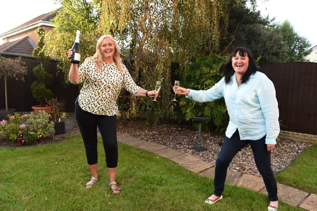 Twins Gill Kaczmarczyk and Jen Heaton celebrating the 10th anniversary of their kidney transplant  Credit: Neil Cross