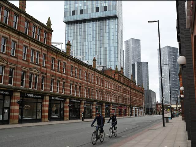 <p>Cyclists riding through Manchester during one of the national lockdowns. Photo: Oli Scarff/AFP via Getty Images</p>