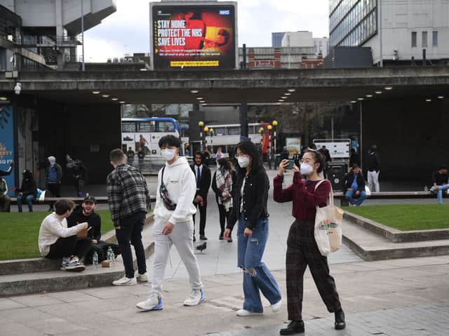People walking in central Manchester. Photo: Oli Scarff/AFP via Getty Images)