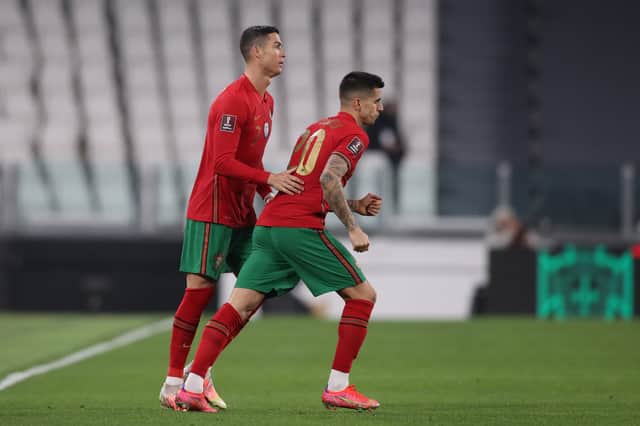 <p>Cristiano Ronaldo and Joao Cancelo. Credit: Getty.</p>