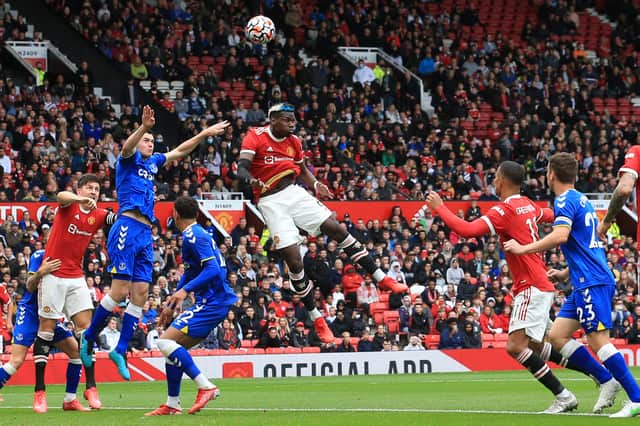 Paul Pogba jumps for the ball. Credit: Getty.